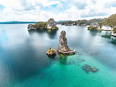 Aerial view of the Batu Pensil, an iconic rock formation in Waigeo Island, one of the Raja Ampat archipelago most popular tourist spots, West Papua, Indonesia