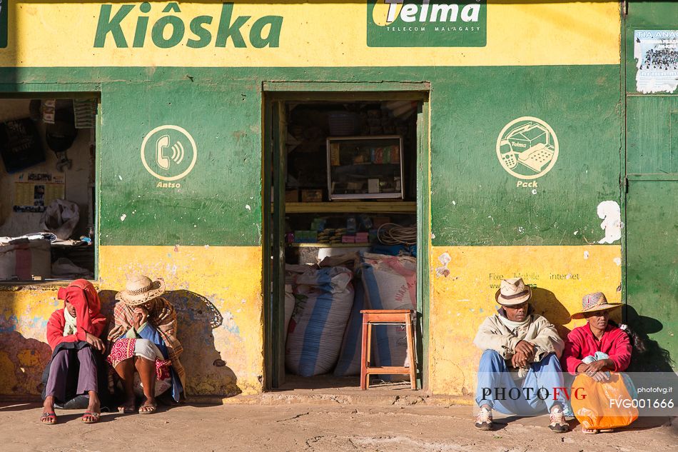 People outside a shop in a village close to Ambositra