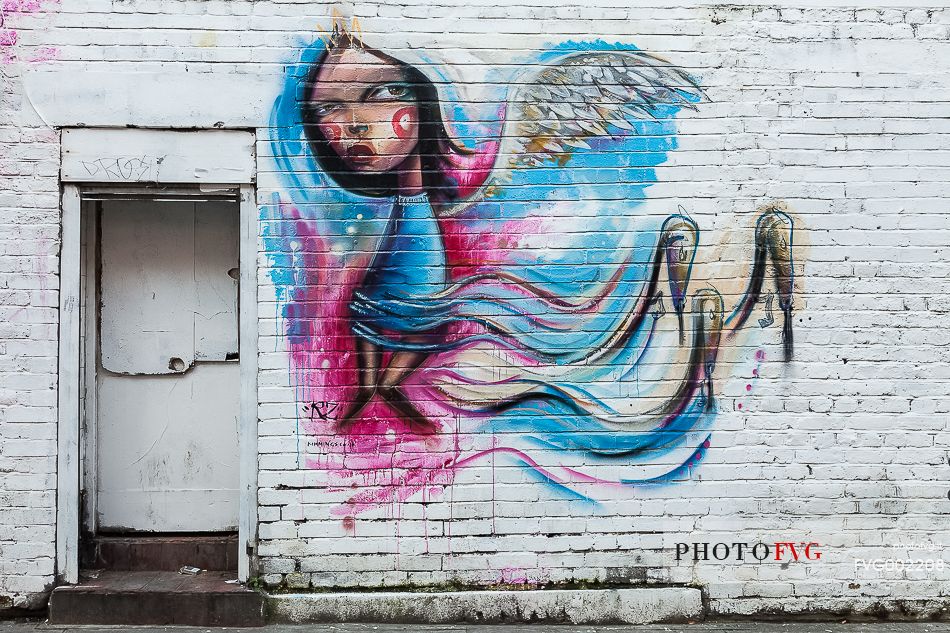 A street art work of artist RZ in a street of Shoreditch