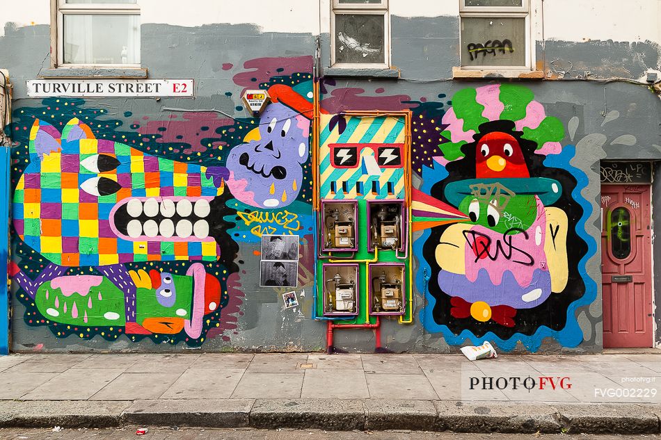 Street art murales of Malarky artist in London borough of Shoreditch