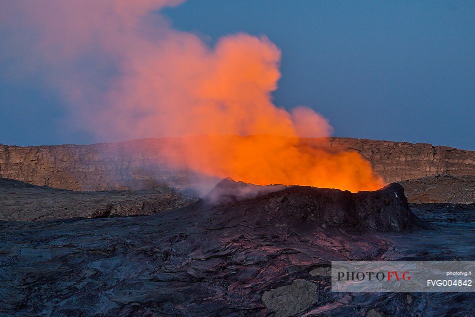 The crater of Erta Ale volcano in eruption at dusk