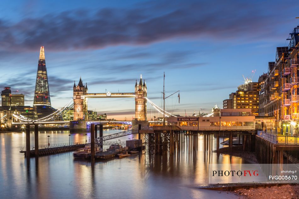 A view of Tower Bridge at dusk from St Katharine Docks