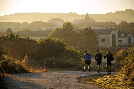 Way of St.James - Pilgrims walking at the sunrise