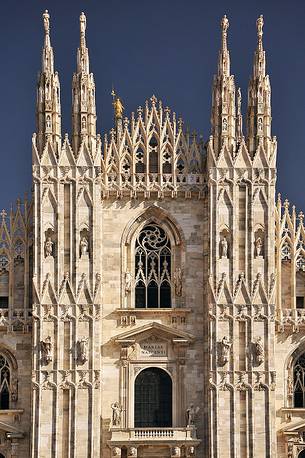 The façade of the Milan Cathedral and the famous The façade of the Milan Cathedral and the famous