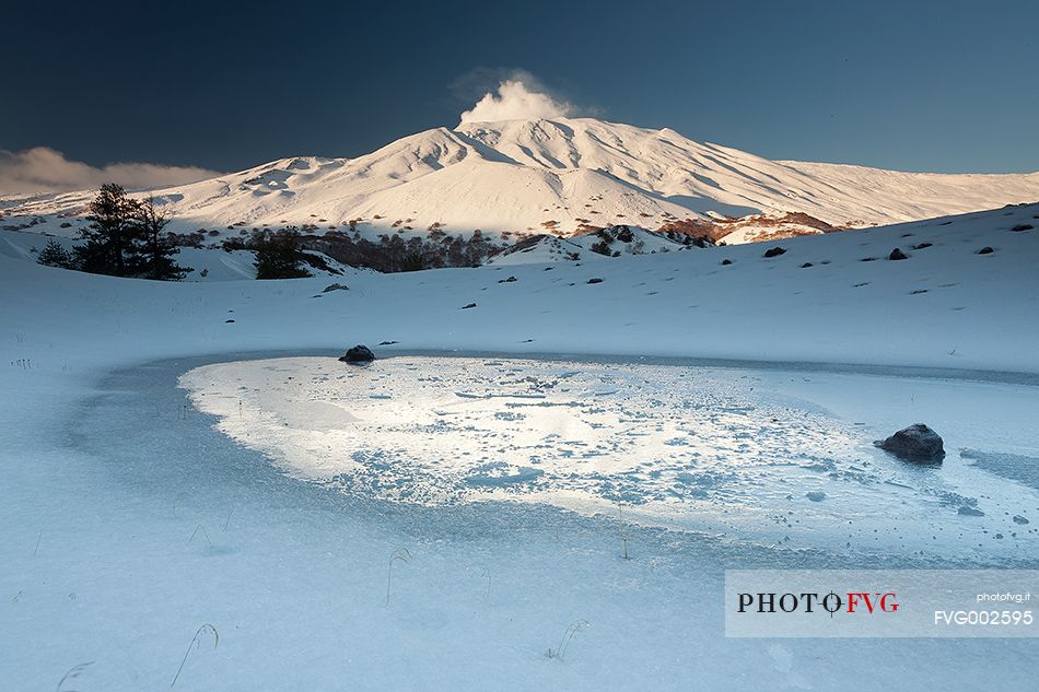 A ice slab inside one of the Sartorius craters , in the background Monte Frumento