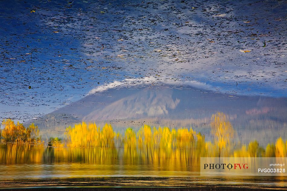 Reflection of Mount Etna on Gurrida lake in the fall 