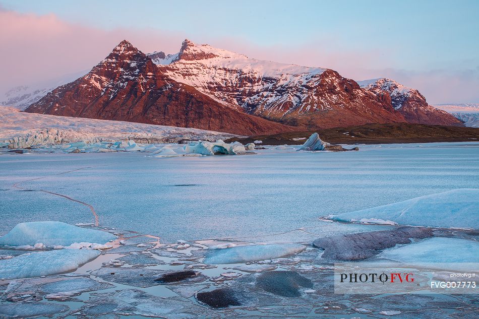 First lights of dawn in a glacier lagoon