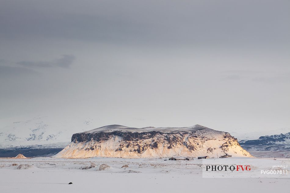 Snowy mountain behind Dyrhlaey beach