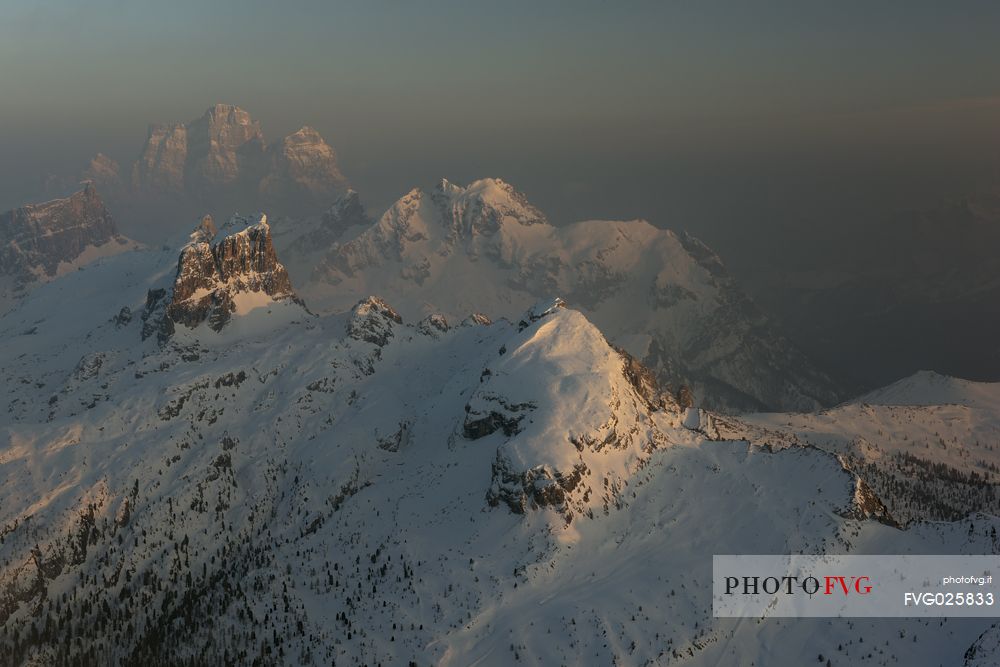 Foggy Sunset from the top of the mountain Lagazuoi towards Monte Pelmo, Averau and Nuvolau, Dolomites, Italy