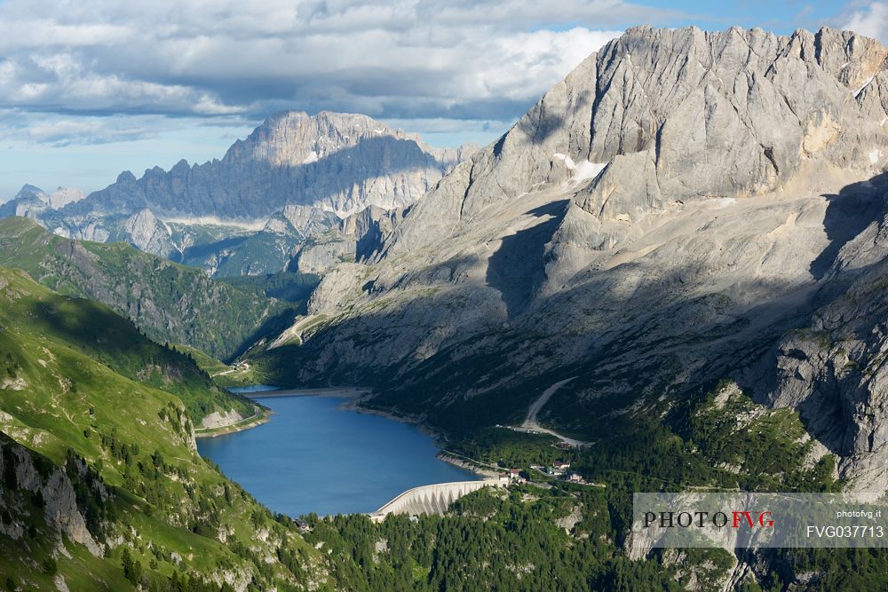 Marmolada mount and Fedaia lake from above, in the backgroundi the Civetta peak, dolomites, Italy, Europe