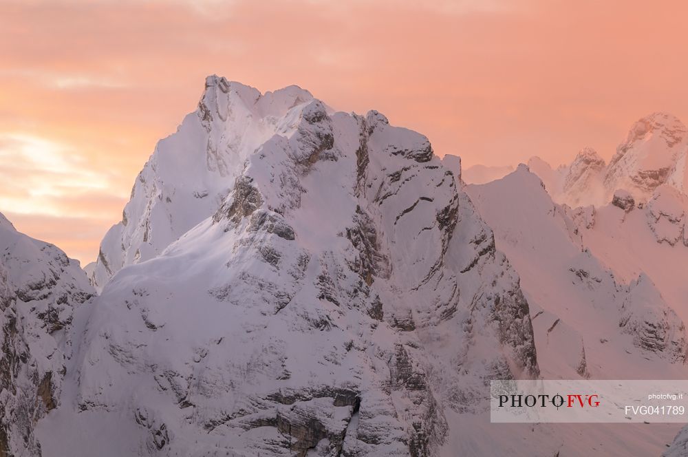 After a heavy snowfall on a cold winter morning, sunrise from Misurina towards the Marmarole mountain group.
At sunrise the Marmarole are wrapped in a pink-colored snow storm, dolomites, Auronzo, Veneto, Italy, Europe