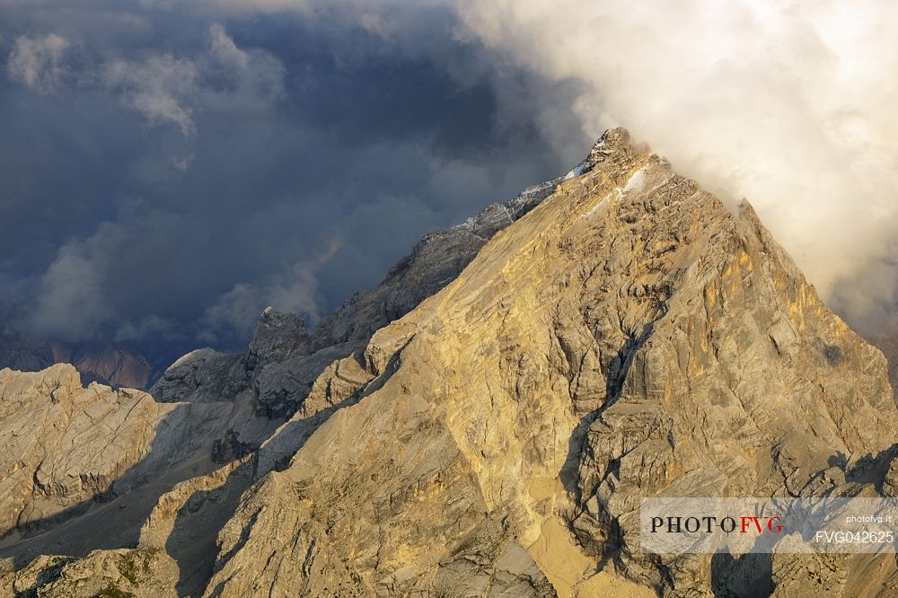 Monte Antelao peak at sunset in the storm from the top of Tofana di Mezzo, Cortina d'Ampezzo, dolomites, Italy.