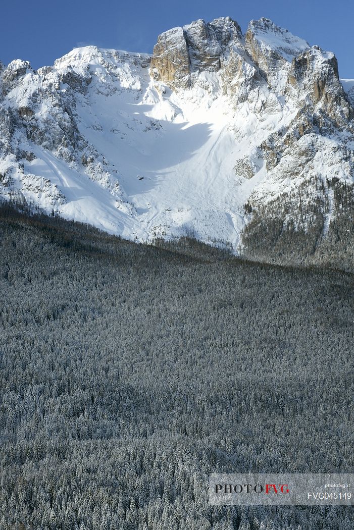 Comelico valley in a winter day, in the background the Croda da Campo peak in the Sesto dolomites, Veneto, Italy, Europe