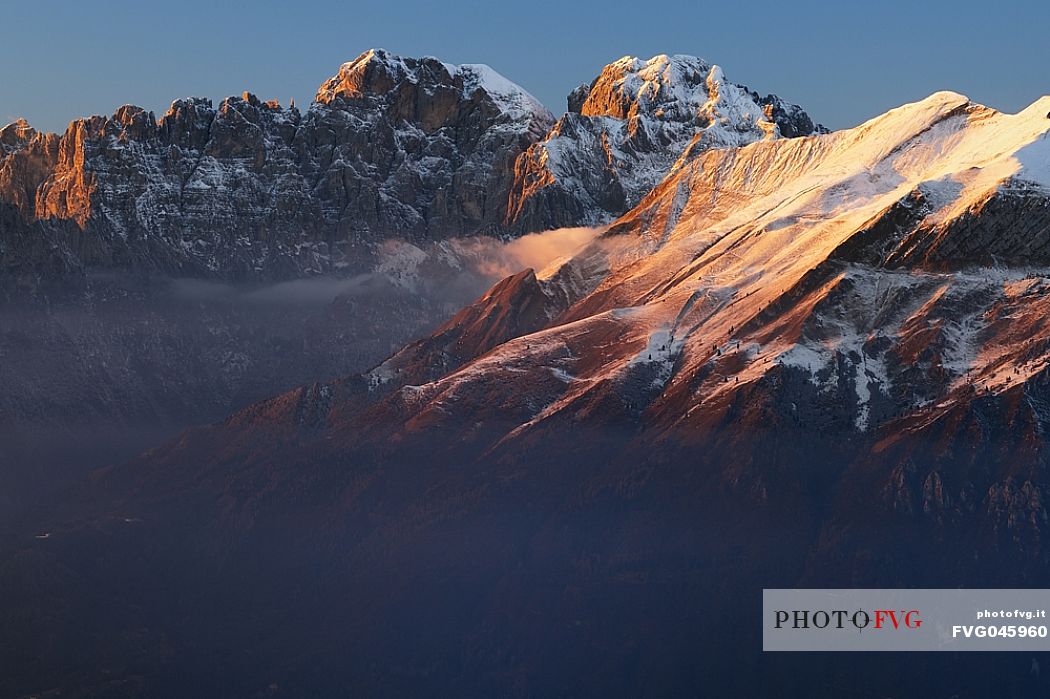 Winter panorama from Nevegal towards Pala Tissi, Pale del Balcon, Gusela del Vescov, Mount Schiara, Mount Pelf and Mount Serva, dolomites, Belluno, Veneto, Italy, Europe.