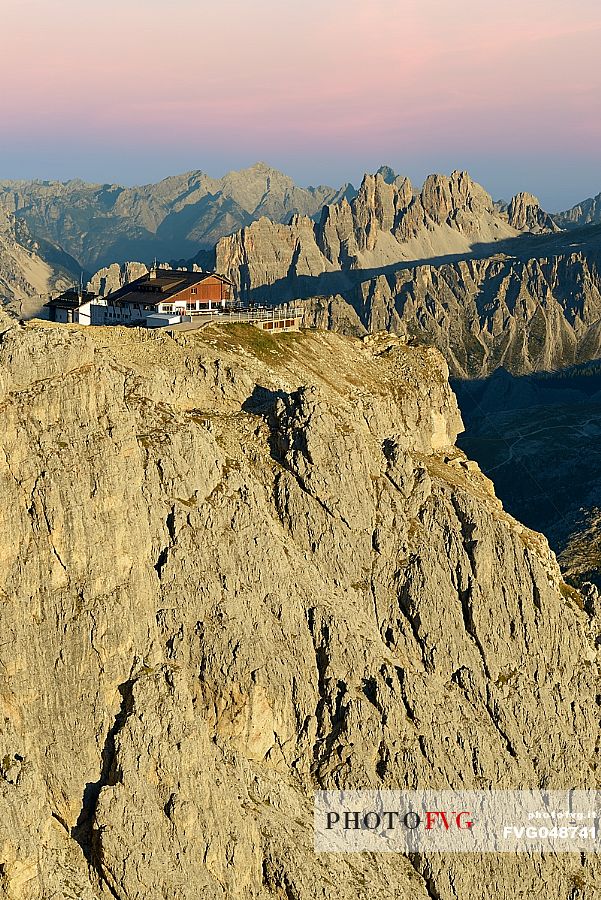 Views from Mount Lagazuoi with the first intense autumn lights, in the background the Lagazuoi refuge and Croda da Lago mount, dolomites, Veneto, Italy, Europe.