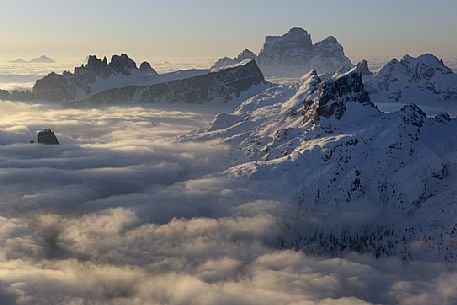 Sunrise from the top of the mountain Lagazuoi towards the Dolomites of Cortina and Zoldana valley.
Cold and windy winter morning with the phenomenon of thermal inversion, dolomites, Italy