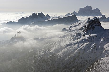 Sunrise from the top of the mountain Lagazuoi towards the Dolomites of Cortina and Zoldana valley.
Cold and windy winter morning with the phenomenon of thermal inversion, dolomites, Italy