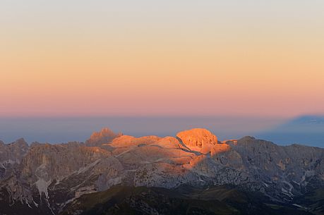 Sunrise from the top of Piz Bo in the Sella mounatin group towards Catinaccio mountain group, dolomites, Italy