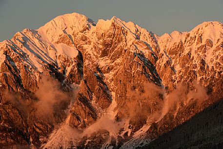 Sunset in the Monte Cavallo mountain range after a heavy snowfall, Tambre, Alpago, Cansiglio forest, Belluno, Prealps, Veneto, Italy, Europe