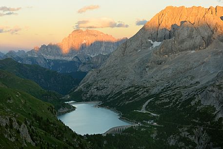 Marmolada mount and Fedaia lake from above, in the backgroundi the Civetta peak, dolomites, Italy, Europe