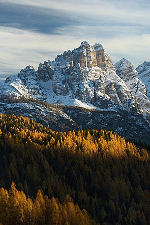 Autumn sunset on the Spiz di Mezzodì Group in Val Zoldana. Characterized by the colorful larch forest, dolomites, Veneto, Italy, Europe Autumn sunset on the Spiz di Mezzodì Group in Val Zoldana. Characterized by the colorful larch forest, dolomites, Veneto, Italy, Europe