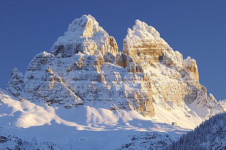 After a heavy snowfall on a cold winter morning, sunrise from Misurina towards the Tre Cime di Lavaredo peak, dolomites, Veneto, Italy, Europe