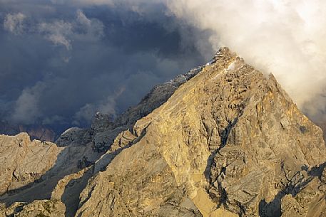 Monte Antelao peak at sunset in the storm from the top of Tofana di Mezzo, Cortina d'Ampezzo, dolomites, Italy.