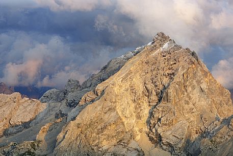 Monte Antelao peak at sunset in the storm from the top of Tofana di Mezzo, Cortina d'Ampezzo, dolomites, Italy. Monte Antelao peak at sunset in the storm from the top of Tofana di Mezzo, Cortina d'Ampezzo, dolomites, Italy.