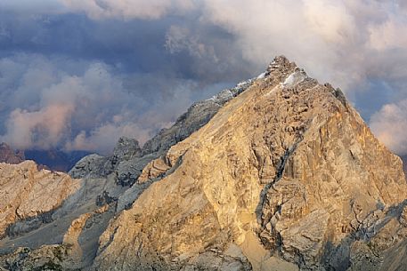 Monte Antelao peak at sunset in the storm from the top of Tofana di Mezzo, Cortina d'Ampezzo, dolomites, Italy.