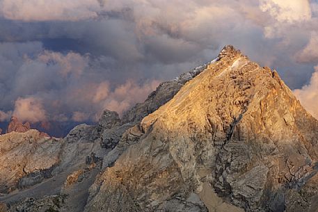 Monte Antelao peak at sunset in the storm from the top of Tofana di Mezzo, Cortina d'Ampezzo, dolomites, Italy.