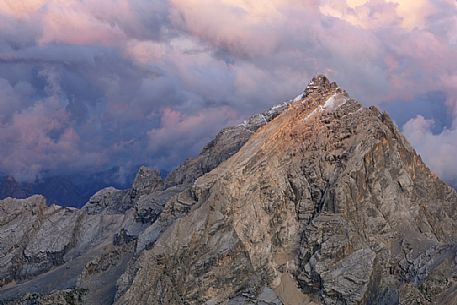 Monte Antelao peak at sunset in the storm from the top of Tofana di Mezzo, Cortina d'Ampezzo, dolomites, Italy.