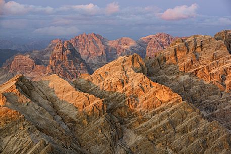 Sunset in the Tre Cime di Lavaredo and Cima Undici peaks from the top of Tofana di Mezzo, Cortina d'Ampezzo, dolomites, Italy.