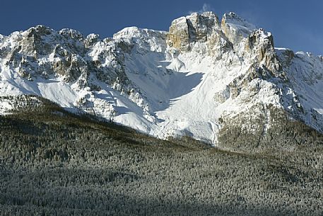 Comelico valley in a winter day, in the background the Croda da Campo peak in the Sesto dolomites, Veneto, Italy, Europe