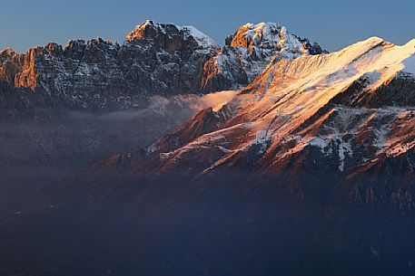 Winter panorama from Nevegal towards Pala Tissi, Pale del Balcon, Gusela del Vescov, Mount Schiara, Mount Pelf and Mount Serva, dolomites, Belluno, Veneto, Italy, Europe.