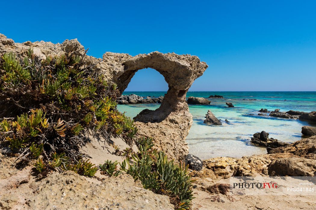 Rocky arch in Elafonissi lagoon the south west Crete island, Greece