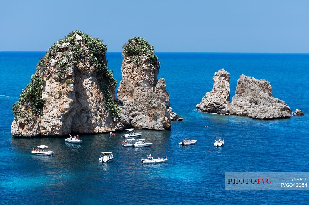 The faraglioni, stack rocks,  in front of the Scopello tonnara, Scopello, Trapani, Sicily, Italy, Europe