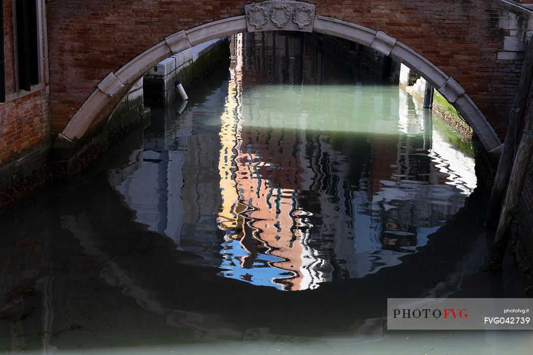 Venetian reflections under the bridge, 