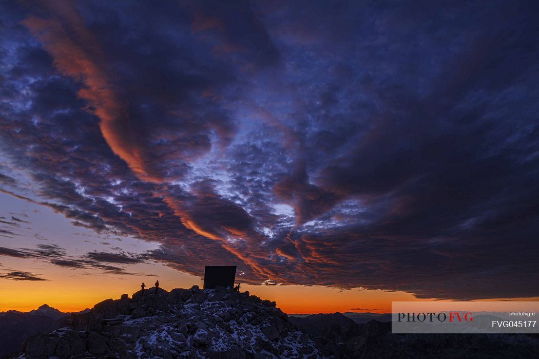 Luca Vuerich bivouac in an autumn sunrise, Foronon del Buinz, Montasio mount, Julian alps, Friuli Venezia Giulia, Italy, Europe