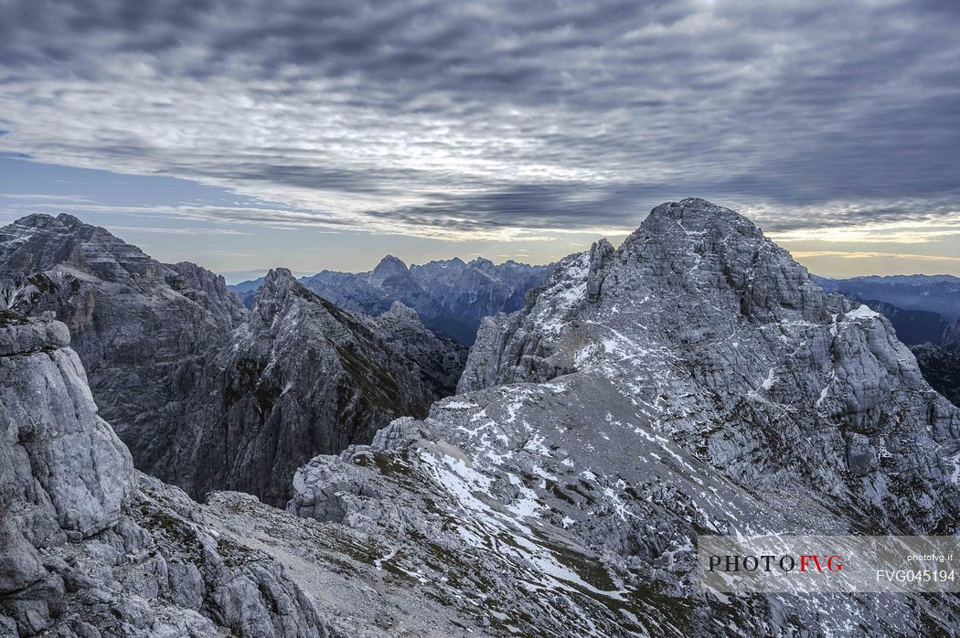 Along the safeguarded climb Ceria Merlone from the top of the Foronon del Buinz towards the Medeon del Buinz in the Montasio group, Julian alps, Friuli Venezia Giulia, Italy, Europe