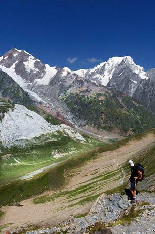 A look at the Aguilles de Tré-la-Tete a few steps from the Col des Chavannes, in the background the Mont Blanc, Courmayeur, Aosta valley, Italy, Europe A look at the Aguilles de Tré-la-Tete a few steps from the Col des Chavannes, in the background the Mont Blanc, Courmayeur, Aosta valley, Italy, Europe