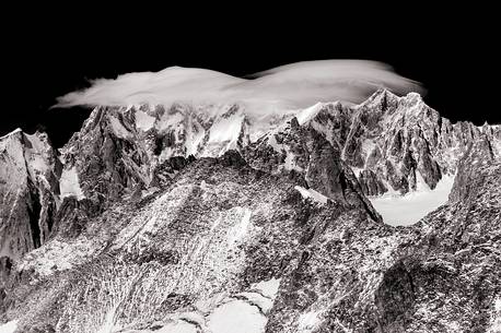 Top of Mont Blanc wrapped in lenticular cloud, Aosta valley, Italy, Europe