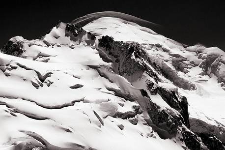 Top of Mont Blanc wrapped by lenticular cloud from the french side, Chamonix, Haute Savoie, France, Europe Top of Mont Blanc wrapped by lenticular cloud from the french side, Chamonix, Haute Savoie, France, Europe