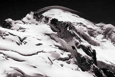 Top of Mont Blanc wrapped by lenticular cloud from the french side, Chamonix, Haute Savoie, France, Europe