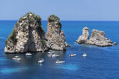 The faraglioni, stack rocks,  in front of the Scopello tonnara, Scopello, Trapani, Sicily, Italy, Europe