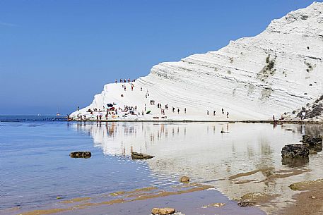 Tourist on the Scala dei Turchi or Stair of the Turks, rocky cliff on the coast between Capo Rossello and Porto Empedocle, Realmonte, Agrigento, Sicily Italy, Europe