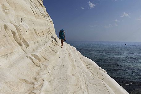 Sea, sky, rock and a person on steep path of the Scala dei Turchi, Realmonte, Agrigento, Sicily, Italy, Europe Sea, sky, rock and a person on steep path of the Scala dei Turchi, Realmonte, Agrigento, Sicily, Italy, Europe