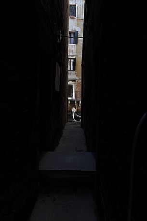 Detail of Gondola seen through a narrow alley, Venice, Italy