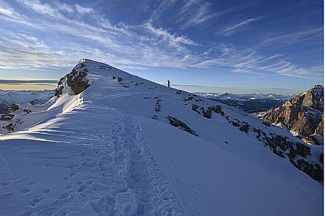 Hiker near the summit of Piccolo Lagazuoi just before sunset, Falzarego, Cortina d'Ampezzo, dolomites, Veneto, Italy, Europe