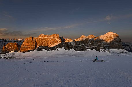 Hiker near the summit of Piccolo Lagazuoi,  admires the Fanis and Tofane mountains at sunset, Falzarego, dolomites, Cortina d'Ampezzo, Veneto, Italy, Europe