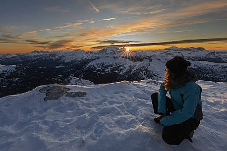 Hiker near the summit of Piccolo Lagazuoi waiting for the sunset behind the Marmolada massif, Cortina d'Ampezzo, dlomites, Veneto, Italy, Europe Hiker near the summit of Piccolo Lagazuoi waiting for the sunset behind the Marmolada massif, Cortina d'Ampezzo, dlomites, Veneto, Italy, Europe